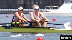 FILE - Helen Glover, left, and Polly Swan compete for Great Britain in the Tokyo Olympics on July 28, 2021. Glover, a two-time Olympic champion, was the first rower to compete for Britain as a mother.