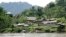 FILE - An Awajun village is seen along the Maranon River in Amazonas state, Peru, Aug. 12, 2009. More than 500 cases of sex abuse dating as far back as 2010 have been reported by Awajun youths who attended public schools in Peru's north.