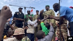 Mohamed Toumba, one of the soldiers who ousted Nigerian President Mohamed Bazoum, addresses supporters of Niger's ruling junta in Niamey, Niger, Aug. 6, 2023.