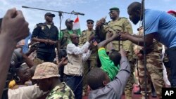 Mohamed Toumba, one of the soldiers who ousted Nigerian President Mohamed Bazoum, addresses supporters of Niger's ruling junta in Niamey, Niger, Aug. 6, 2023.