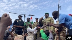 FILE - Mohamed Toumba, one of the soldiers who ousted Nigerian President Mohamed Bazoum, addresses supporters of Niger's ruling junta in Niamey, Niger, Aug. 6, 2023.