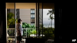 Retired mailman and Vietnam veteran Thomas Leonard, whose condo burned in the 2023 wildfire, looks out to the ocean at his temporary residence at the Royal Kahana, July 8, 2024, in the Napili-Honokowai area near Lahaina, Hawaii.