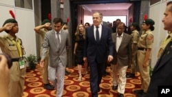 Russian Foreign Minister Sergey Lavrov, center, arrives to attend the opening ceremony of exhibition ''Leo Tolstoy – Mahatma Gandhi'' on the sideline of G20 foreign minister's meeting in New Delhi, India, March 1, 2023. 