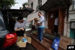 Volunteers sort humanitarian aid at a collection station in Moscow on Aug. 13, 2024, following Ukraine's offensive into Russia's western Kursk region.