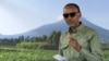 Rwanda's incumbent President and presidential candidate for the Rwandan Patriotic Front (RPF) Paul Kagame prepares to cast his ballot during the Presidential election at the SOS Kinyinya polling center in Kigali, July 15, 2024. 