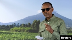 Rwanda's incumbent President and presidential candidate for the Rwandan Patriotic Front (RPF) Paul Kagame prepares to cast his ballot during the Presidential election at the SOS Kinyinya polling center in Kigali, July 15, 2024. 