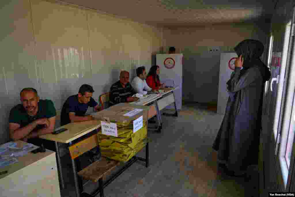 Some observers say the polls in the areas still reeling from the earthquake are not as busy as in past elections because so many people have died or been displaced, May 14, 2023, in Nurdagi.