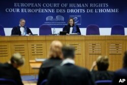 President of the European Court of Human Rights Síofra O'Leary, center, speaks Apr. 9, 2024 in Strasbourg, eastern France.
