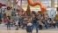 Holiday travelers pass by "Phoebe" the Flamingo at the Tampa International Airport, Dec. 22, 2023, in Tampa, Fla.