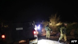 Israeli soldiers search for a rocket that landed near Kibbutz Meitsar in the Israeli annexed Golan Heights, April 9, 2023.