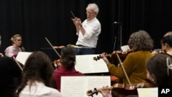 Benjamin Zander conducts the Boston Philharmonic during a rehearsal of Beethoven's Ninth Symphony on Feb. 16, 2023, in Boston. (AP Photo/Michael Dwyer)