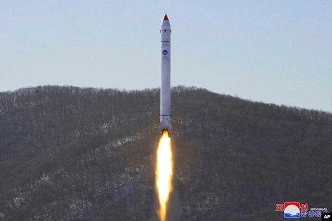 FILE - This photo provided by the North Korean government shows what it says is a test of a rocket with the test satellite at the Sohae Satellite Launching Ground in North Korea, Dec. 18, 2022.