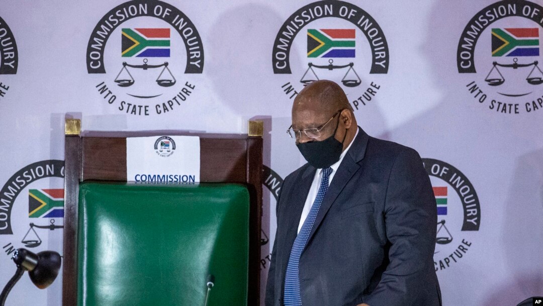 FILE - Judge Raymond Zondo, chairman of a judicial inquiry into corruption in South Africa from 2009-2018 arrives in court, in Johannesburg, South Africa, Nov. 19, 2020.
