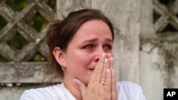 A woman reacts near the site of Okhmatdyt children&rsquo;s hospital hit by Russian missiles, in Kyiv, Ukraine.&nbsp;A major Russian missile attack across Ukraine killed at least 31 people and injured more than 50, officials said.