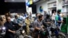 People wait for their turn to get fuel at a petrol station, after petrol dealers across the country announced they are going on strike against taxes imposed by the government, in Karachi, Pakistan, July 4, 2024.