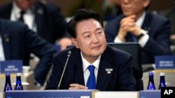 FILE - South Korea's President Yoon Suk Yeol attends a session of the NATO summit with Indo-Pacific Partners in Washington, July 11, 2024.