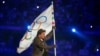 Tom Cruise carries the Olympic flag during the 2024 Summer Olympics closing ceremony at the Stade de France, Aug. 11, 2024, in Saint-Denis, France. 