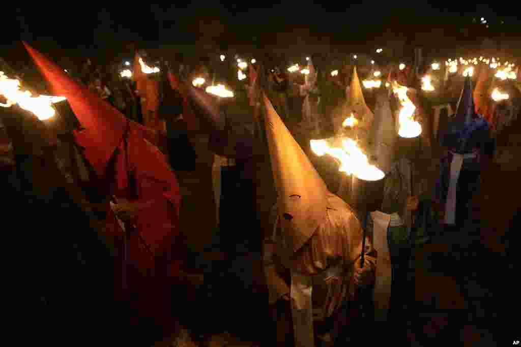 Hooded penitents take part in the Procissao do Fogareu, or Torch Procession, during a Holy Week in Goias, 350 km (217 miles) west of Brasilia, Brazil.&nbsp;The procession is a reenactment of the moment of Christ&#39;s arrest at the Olive Garden by featuring hooded penitents in lieu of Roman soldiers.&nbsp;