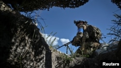FILE - A member of Ukraine's 3rd Separate Assault Brigade conducts a reconnaissance mission amid Russia's attack on Ukraine, near Bakhmut, Ukraine, Sept. 7, 2023. 
