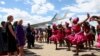 First lady Jill Biden watches a dance performance as she arrives during the first leg of her African visit, at the Hosea Kutako International Airport in Windhoek, in Namibia, Feb. 22, 2023. 