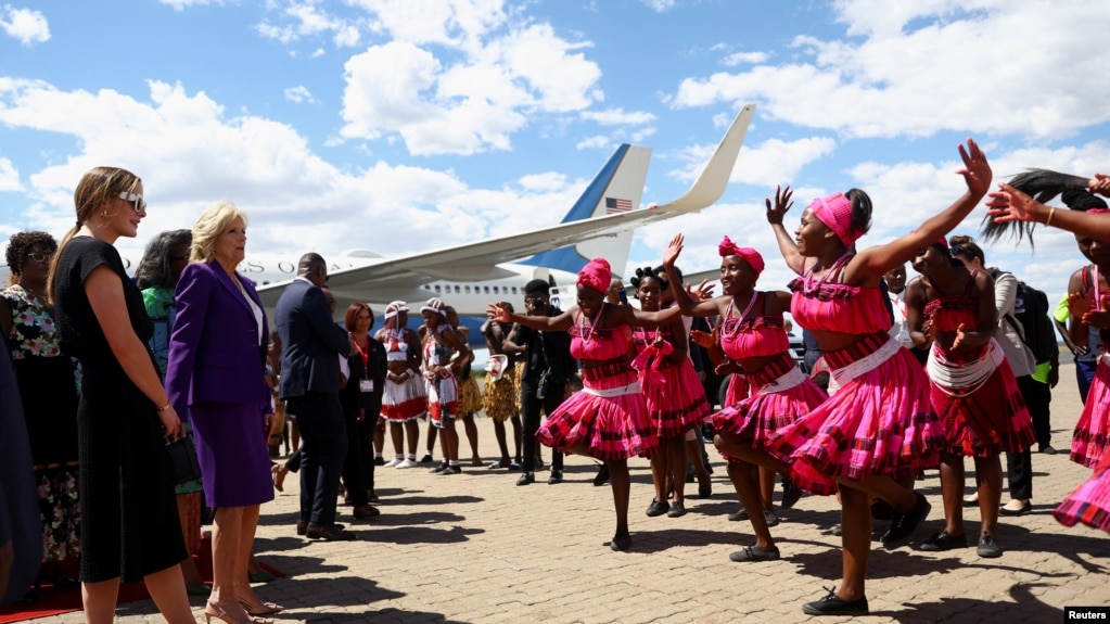 First lady Jill Biden watches a dance performance as she arrives during the first leg of her African visit, at the Hosea Kutako International Airport in Windhoek, in Namibia, Feb. 22, 2023. 