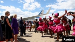 First lady Jill Biden watches a dance performance as she arrives during the first leg of her African visit, at the Hosea Kutako International Airport in Windhoek, in Namibia, Feb. 22, 2023. 