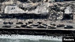 The shells of burnt cars and buildings are seen after wildfires tore through the town in Lahaina, Maui, Hawaii, Aug. 11, 2023. (Hawaii Department of Land and Natural Resources/Handout via Reuters)