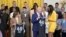 U.S. President Joe Biden is presented with a team jersey by Las Vegas Aces star A'ja Wilson while Vice President Kamala Harris is presented with a jersey by Chelsea Gray  during a celebration of the 2023 WNBA champions at the White House on May 9, 2024.