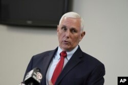 FILE - Former Vice President Mike Pence speaks with reporters following a roundtable discussion on police reform, March 2, 2023, in North Charleston, S.C.