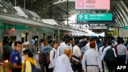 Passengers arrive at a metro train station in Dhaka on August 25, 2024. Bangladesh's metro in the notoriously congested capital Dhaka resumed on Aug. 25, more than a month after it was closed during peak of student-led protests.