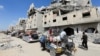 Displaced Palestinians make their way as they flee Hamad City following an Israeli evacuation order, amid Israel-Hamas conflict, in Khan Younis in the southern Gaza Strip, Aug. 11, 2024. 