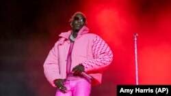 FILE: "Young Thug," Jeffery Williams, performs at the Lollapalooza Music Festival on Aug. 1, 2021, in Chicago. The Atlanta rapper was arrested Monday, May 9, 2022, in Georgia on conspiracy to violate the state's RICO act and street gang charges, according to jail records. 