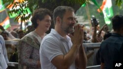 India's opposition Congress party leader Rahul Gandhi greets media personnel as he arrives at party headquarters in New Delhi, India, Aug. 4, 2023.