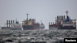 FILE - Under the Black Sea Grain Initiative, vessels await inspection in the southern anchorage of the Bosphorus in Istanbul, Turkey, Dec. 11, 2022. 