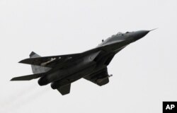 FILE - A view of a MiG-29 aircraft at Sliac Air Base, in Sliac, Slovakia, Feb. 29, 2008.