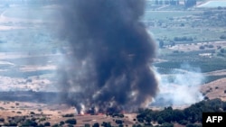 Smoke billows after a hit from a rocket fired from southern Lebanon over the Upper Galilee region in northern Israel on July 21, 2024, amid ongoing cross-border clashes between Israeli troops and Lebanon's Hezbollah fighters. 