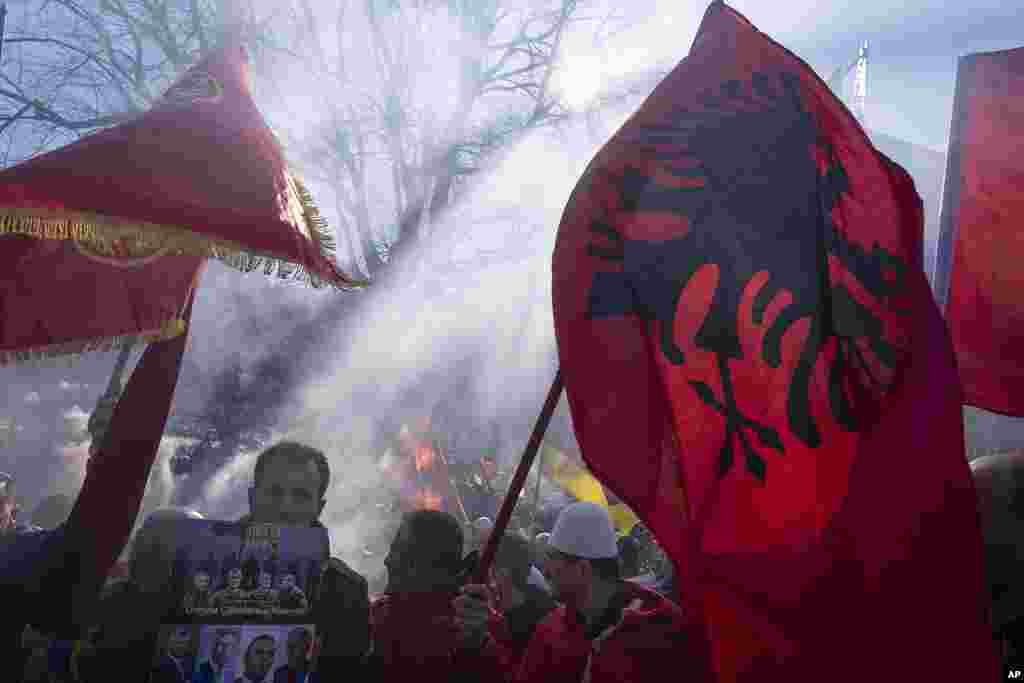 Supporters of former Kosovo president Hashim Thaci and three other defendants protest in The Hague, Netherlands, near the special court where Thaci goes on trial on charges of war crimes and crimes against humanity linked to their roles in Kosovo&#39;s war for independence from Serbia in the late 1990s.