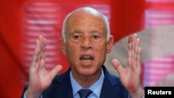 FILE - Presidential candidate Kais Saied speaks during a news conference after the announcement of the results in the first round of Tunisia's presidential election in Tunis, Tunisia September 17, 2019.