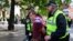 FILE - An anti-immigration protester is detained by police officers, in Newcastle, Britain Aug. 10, 2024. 