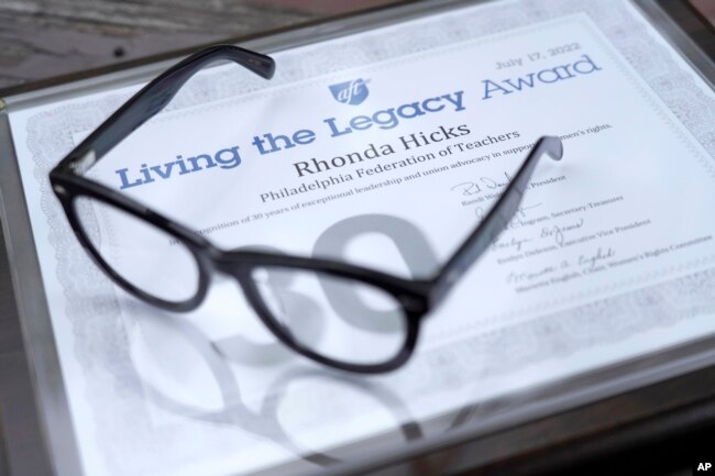 The Living the Legacy award given to Rhonda Hicks is shown at her home in Philadelphia, Thursday, July 20, 2023. The award is from the American Federation of Teachers in recognition of 30 years of exceptional leadership and union advocacy in support of women's rights. (AP Photo/Michael Perez)