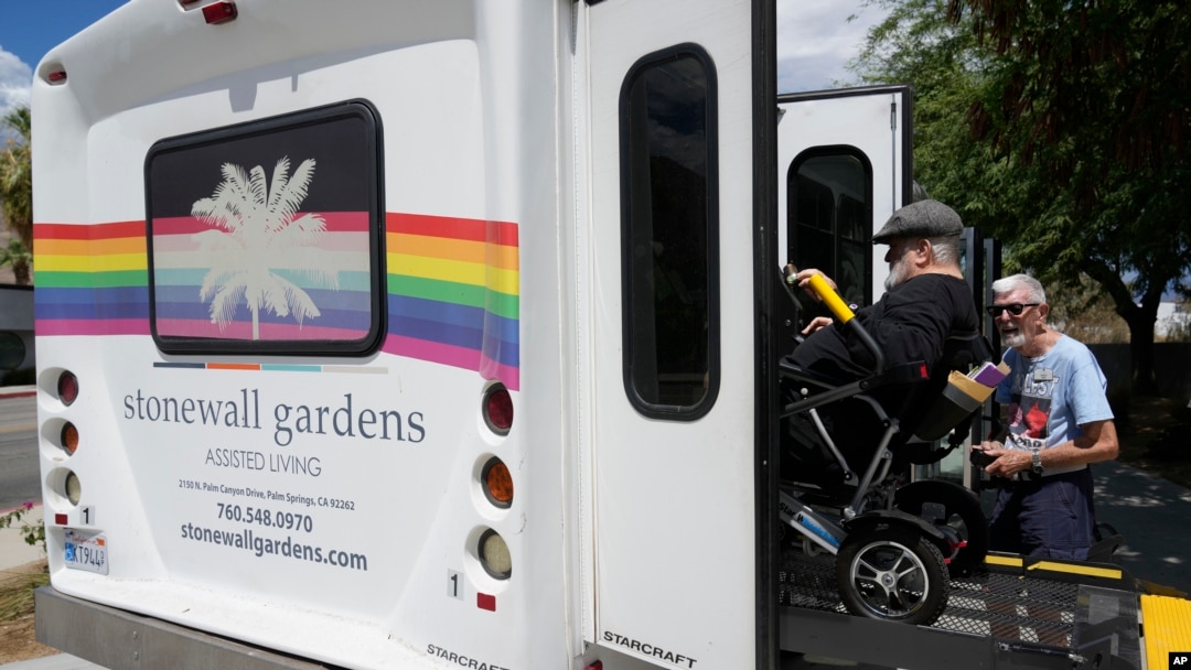 Resident Billy Church is helped into a van headed for a group lunch at Stonewall Gardens, an LGBTQ assisted living facility, on Aug. 15, 2023, in Palm Springs, California. About 171,000 of the more than 1.3 million transgender adults in the United States are 65 and older.