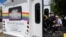Resident Billy Church is helped into a van headed for a group lunch at Stonewall Gardens, an LGBTQ assisted living facility, on Aug. 15, 2023, in Palm Springs, California. About 171,000 of the more than 1.3 million transgender adults in the United States are 65 and older.