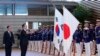 South Korean President Yoon Suk Yeol, center, and Japanese Prime Minister Fumio Kishida, left, attend an honor guard ceremony, ahead of their bilateral meeting at the Prime Minister's Office, in Tokyo, March 16, 2023.