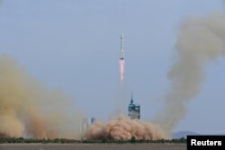 FILE - A Long March-2F carrier rocket, carrying the Shenzhou-16 spacecraft and three astronauts, takes off from the launching area of Jiuquan Satellite Launch Center on May 30, 2023. (China Daily via REUTERS)