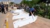 A man looks at a dead body, after a powerful storm and heavy rainfall hit Libya, in Derna, Libya Sept. 12, 2023. 