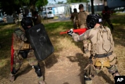 Soldiers train at a military camp set up for the Paris games just outside Paris, July 19, 2024.