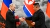 FILE - Russian President Vladimir Putin, left, and North Korea's leader Kim Jong Un exchange documents during a signing ceremony of a new partnership agreement in Pyongyang, North Korea, June 19, 2024.