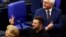 Ukrainian President Volodymyr Zelenskyy, middle, gestures following his address to the lower house of parliament Bundestag in Berlin, Germany, June 11, 2024.