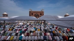 Indian Muslims pray together on the last Friday of the holy fasting month of Ramadan at Jama Masjid in New Delhi, India. (AP Photo/Altaf Qadri)