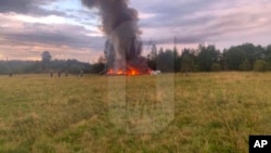 This image released and watermarked by Ostorozhno Novosti on Aug. 23, 2023, shows the crash site of a private jet near the village of Kuzhenkino, Tver Region. Officials say a private jet has crashed over Russia, killing all 10 people on board.